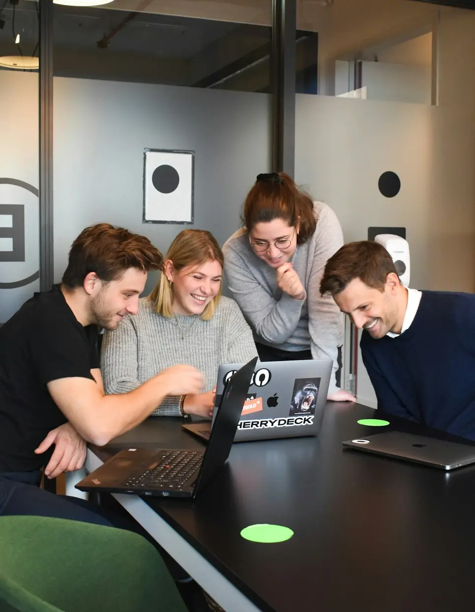 people sitting on chair in front of laptop computers